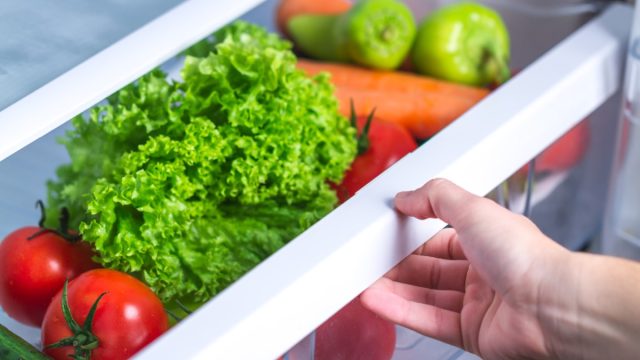 opening fridge with vegetables