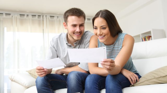 couple looking at checks