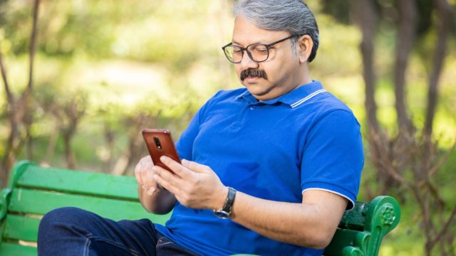 senior man using android smartphone