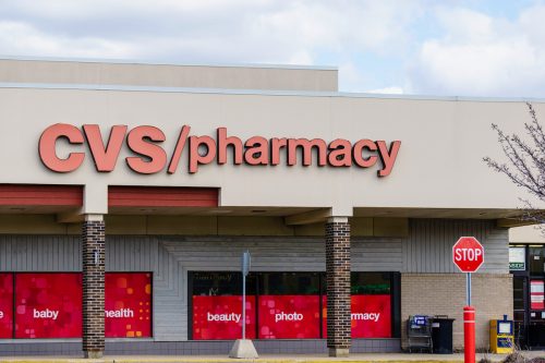 CVS Pharmacy storefront with a stop sign in front