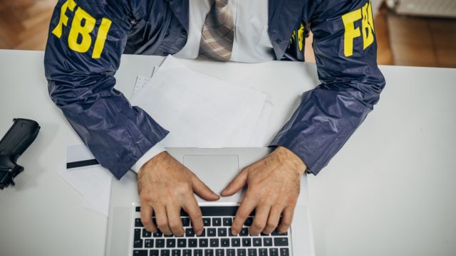 FBI agent on computer