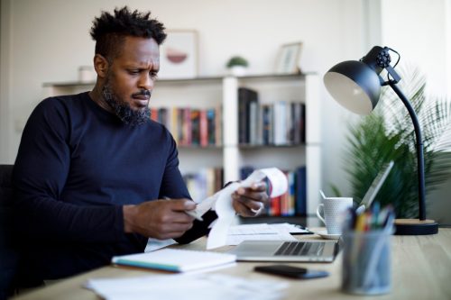 Man calculating budget and finances