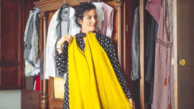 Woman is choosing the right dress to wear