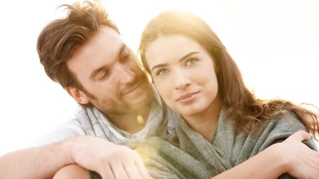 Portrait,Of,Young,Love,Couple,Sitting,Outdoor,In,Sun,Light,
