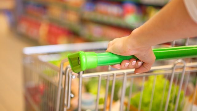 woman pushing shopping cart