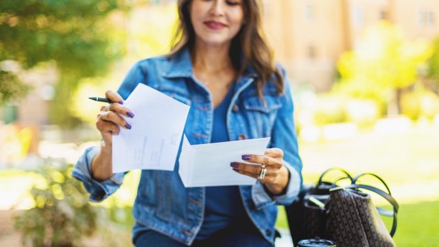 Adult Female Voter with Mail in Voting Election Ballot in Western USA