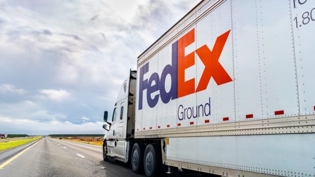 FedEx Ground truck driving on the interstate