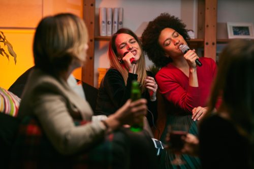 two women singing together
