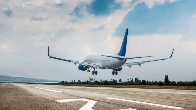 A passenger plane landing at an airport