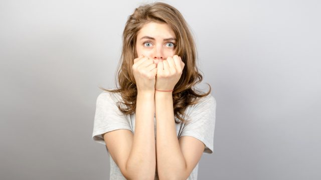 woman biting her nails