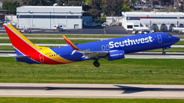 A Southwest Airlines plane taking off from the runway at an airport