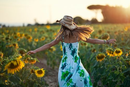 woman visiting sun flower farm
