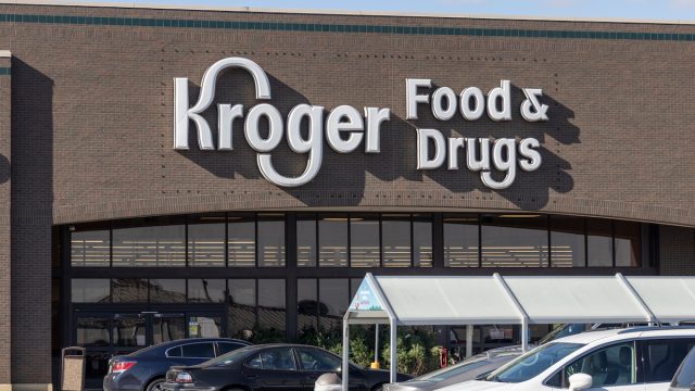 A closeup of a Kroger Food & Drugs store with white logo.