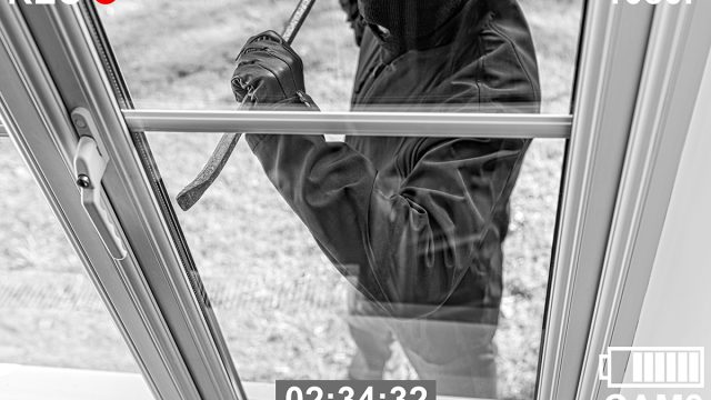 Cctv,View,Of,Burglar,Breaking,In,To,Home,Through,Window