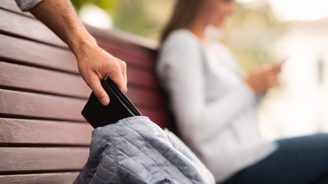 thief stealing wallet