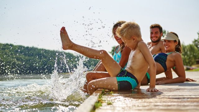 Family Splashing on a Lake