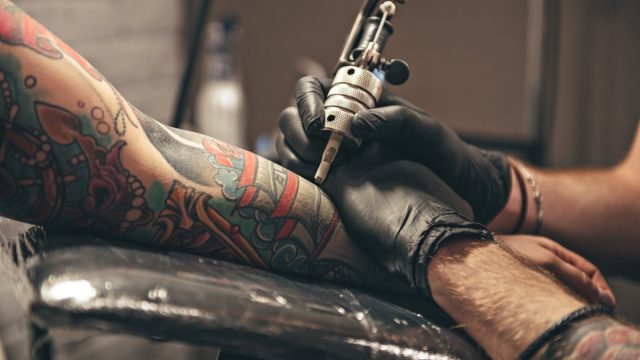 tattoo artist giving tattoo
