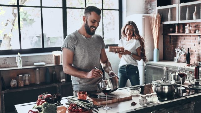 couple cooking in kitchen