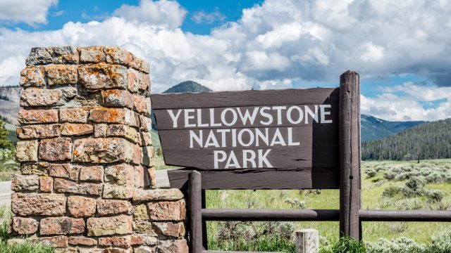 An entrance sign for Yellowstone National Park