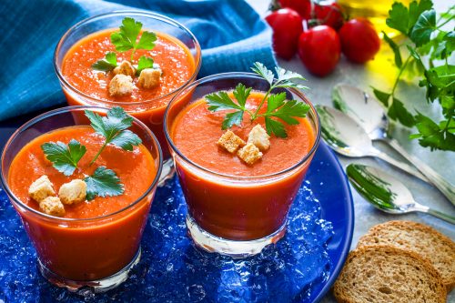 Three Spanish gazpacho in drinking glasses