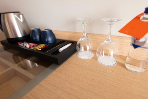 glasses and coffeemaker hotel