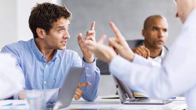 Frustrated entrepreneurs arguing during a business meeting in the office.