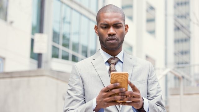 man looking concerned at phone