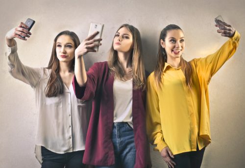 Three Girls Taking Selfies