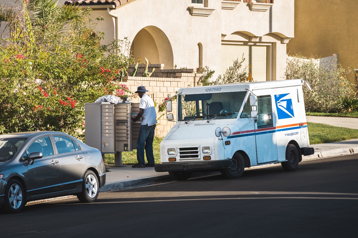 US postal worker delivering mail