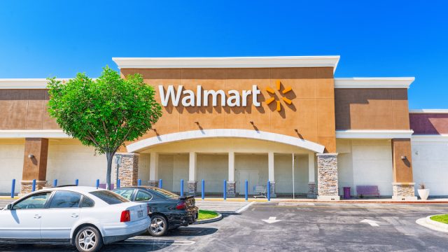 Outside of a Walmart store on a sunny day.