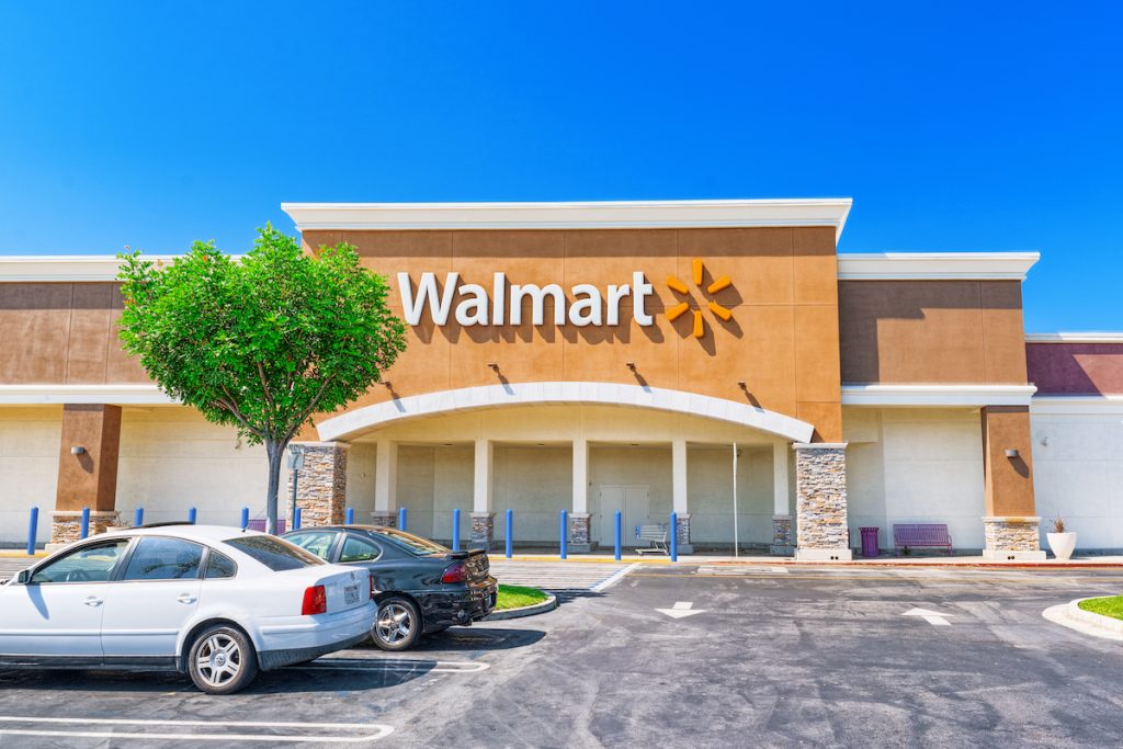 Outside of a Walmart store on a sunny day.