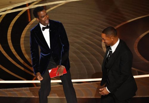 Chris Rock and Will Smith on stage at the 2022 Oscars