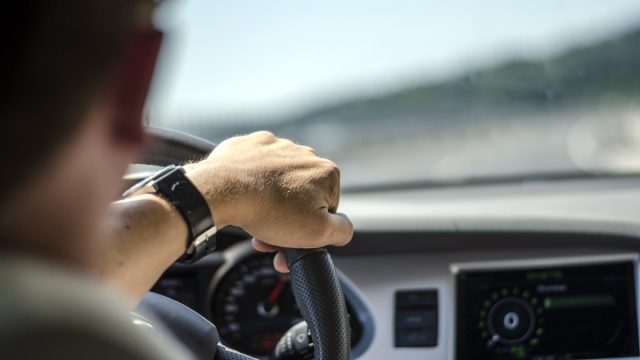 man driving car