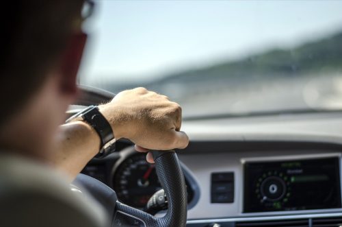 man driving car