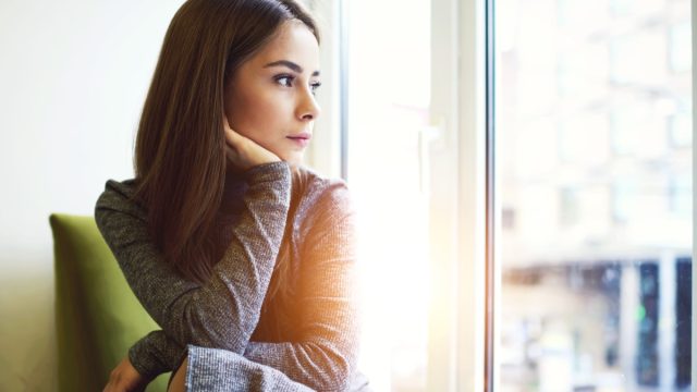 woman thinking and looking out window