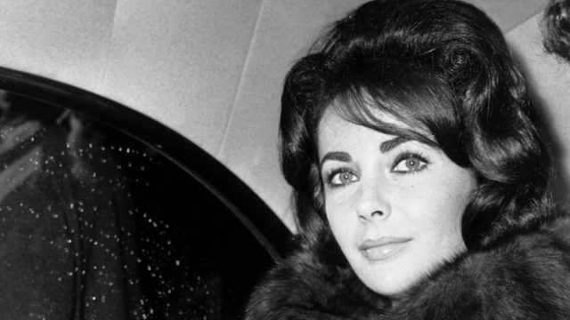 Elizabeth Taylor photographed in a car in Paris in 1960