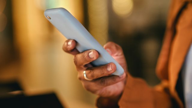 woman hands typing on phone, sending a text message online on social media.