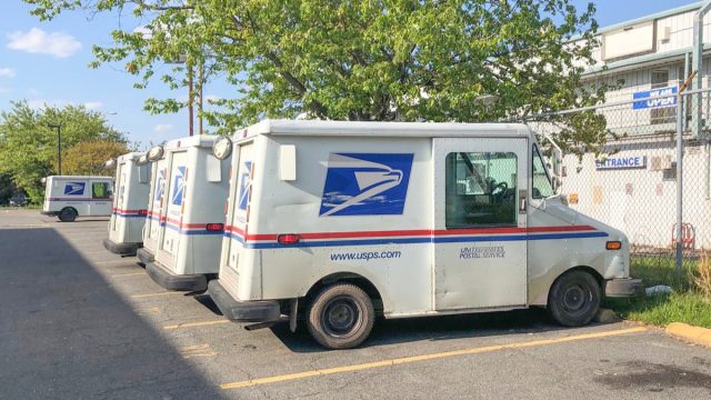 Mclean, Va, USA - May, 15, 2020 USPS car trucks on the parking lot. Postal Workers American Heroes concept.