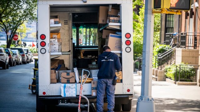 New York NY/USA-May 10, 2020 USPS worker sorts packages in the Greenwich Village neighborhood in New York