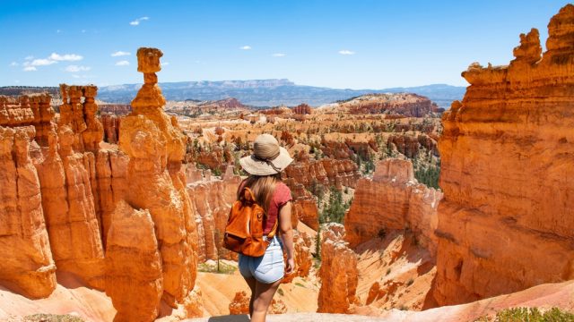 A woman looking at a vista in Bryce Canyon National Park during a hike