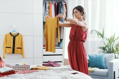 Woman trying on new clothes. 