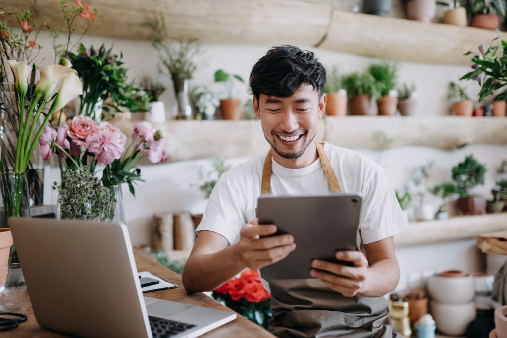 Asian male business owner and florist