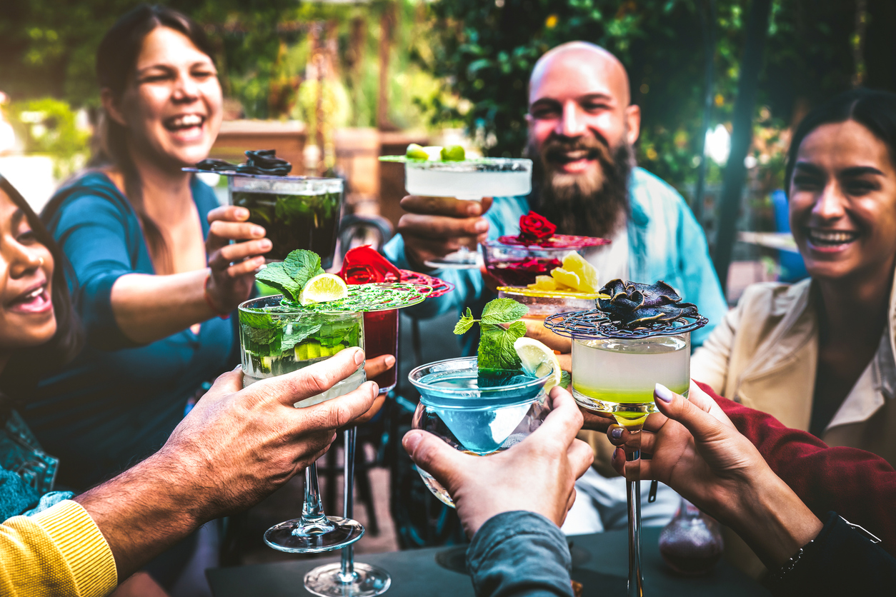 diverse friend group enjoying mocktails together