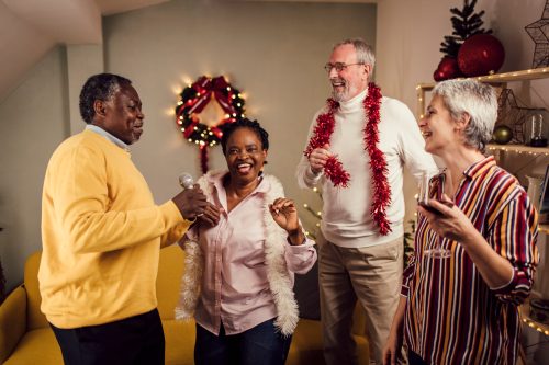 seniors singing and enjoying christmas music together at home