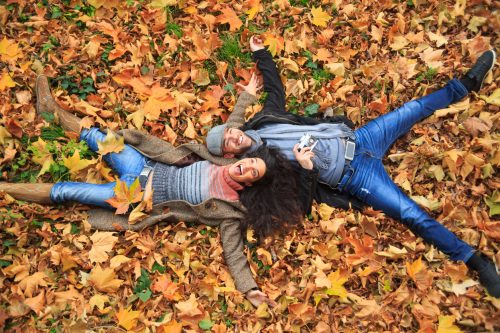 Man and woman in leaves
