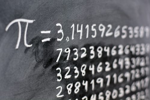 the number pi written out on a chalkboard