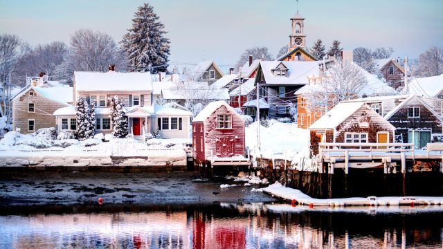 View across the lake of snow-covered houses in Portsmouth, New Hampshire.