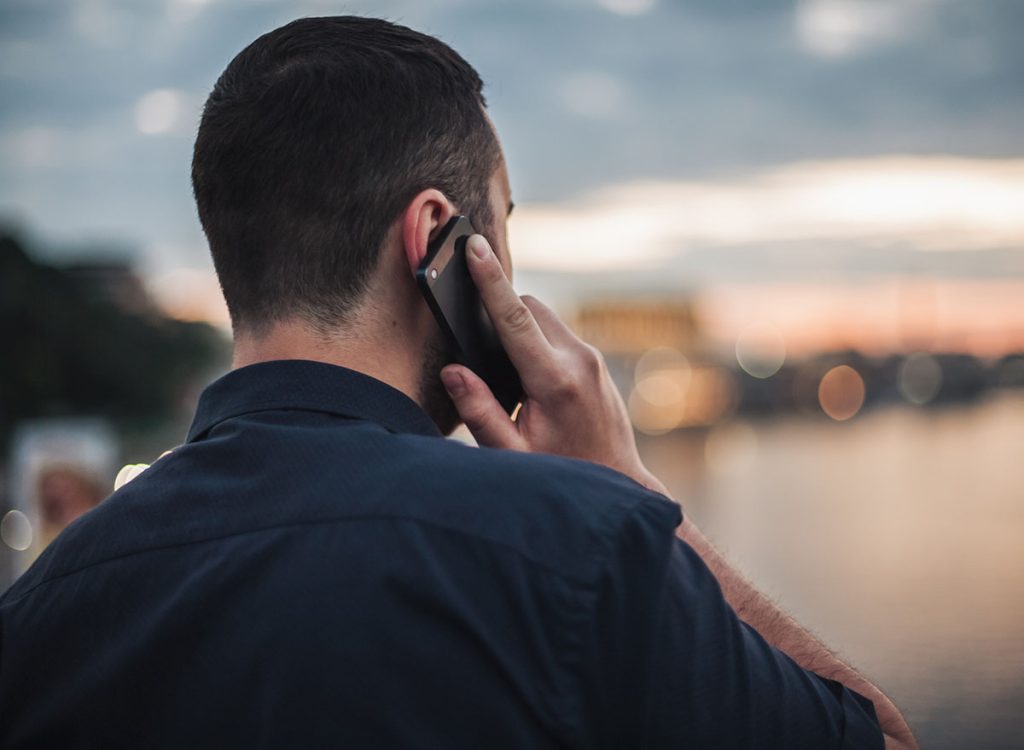 Shot of man on his phone from behind