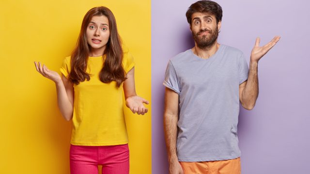 man and woman shrugging their shoulders and looking confused