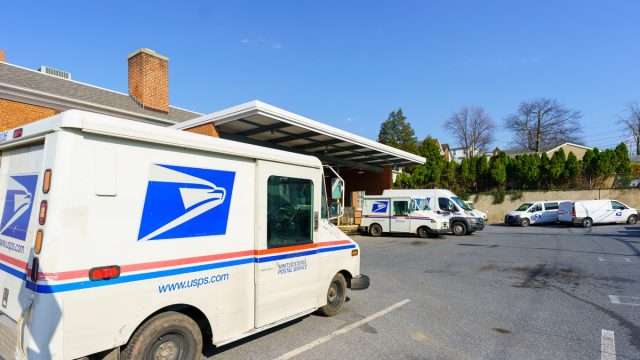 USPS Mail delivery trucks parked at the Ephrata Post Office in Lancaster County, PA.